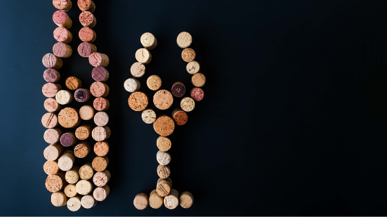 Corks set-up in the design of a wine bottle and glass