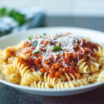 Photo of lentil bolognese on a white plate