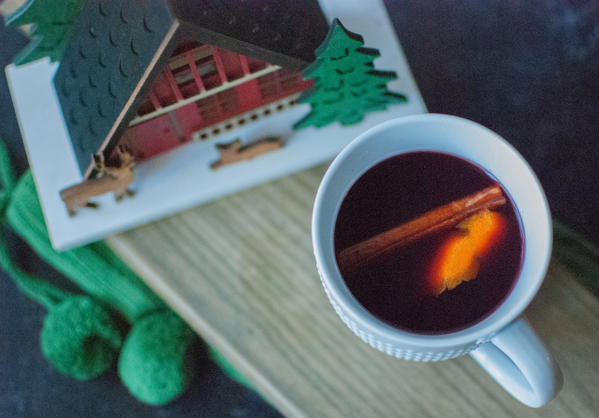 Overhead shot of hot mulled wine with holiday decor